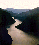 photo of a river flowing through mountains